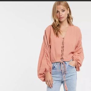 ASOS DESIGN long sleeve top in crinkle with tie front detail